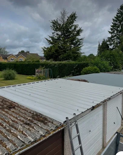 New box profile metal roof sheets being fitted after asbestos cement removal